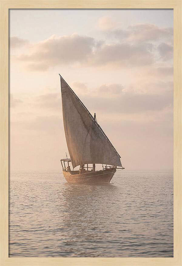 Traditional Dhow Sailing Into The Horizon