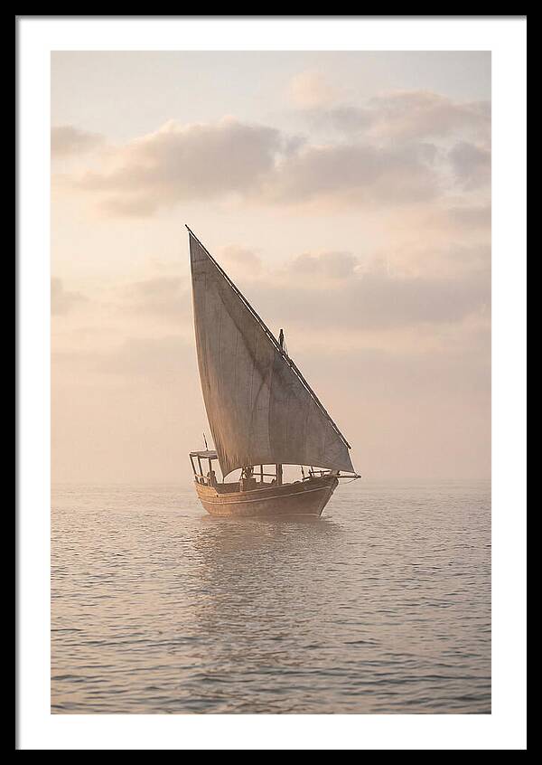 Traditional Dhow Sailing Into The Horizon
