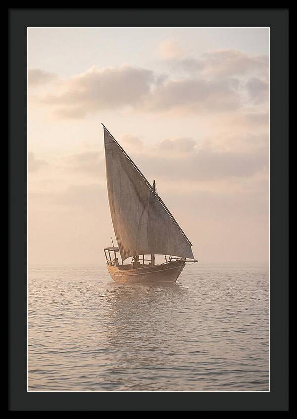 Traditional Dhow Sailing Into The Horizon