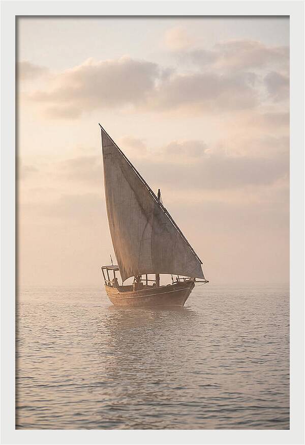 Traditional Dhow Sailing Into The Horizon