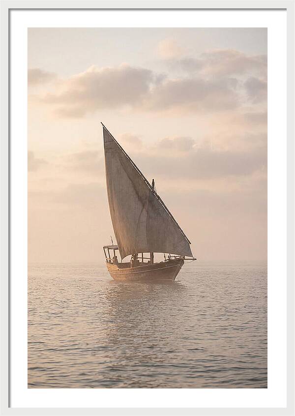 Traditional Dhow Sailing Into The Horizon