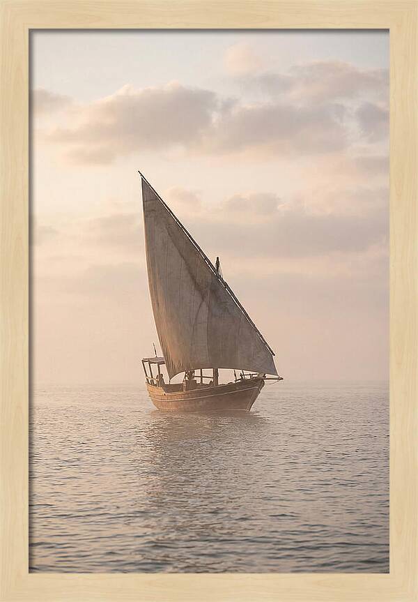 Traditional Dhow Sailing Into The Horizon
