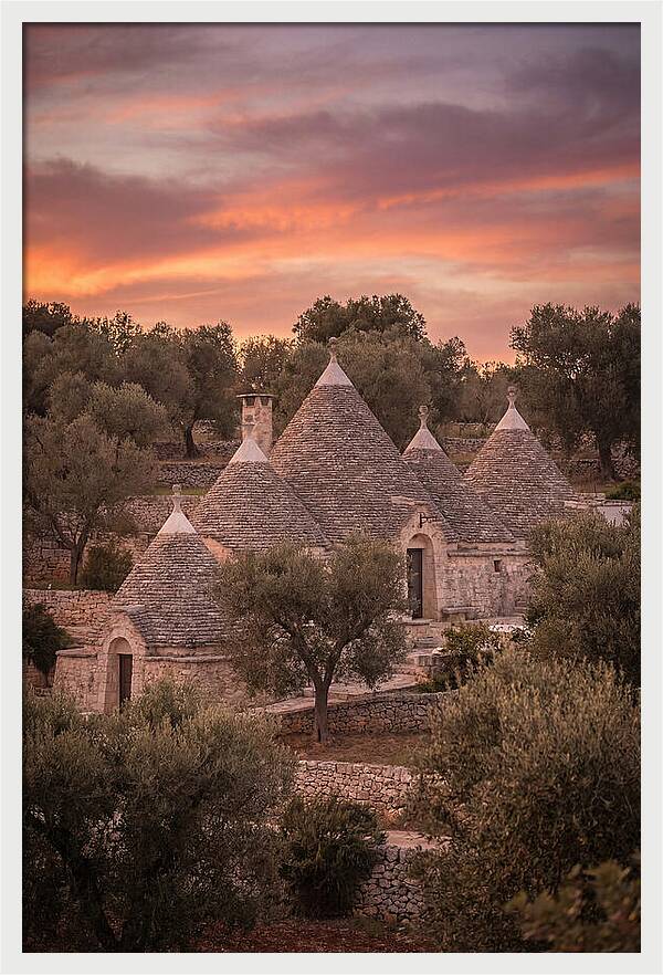 Trulli Houses Under Sunset Skies