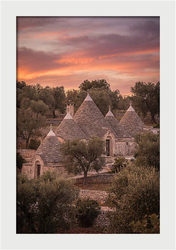 Trulli Houses Under Sunset Skies