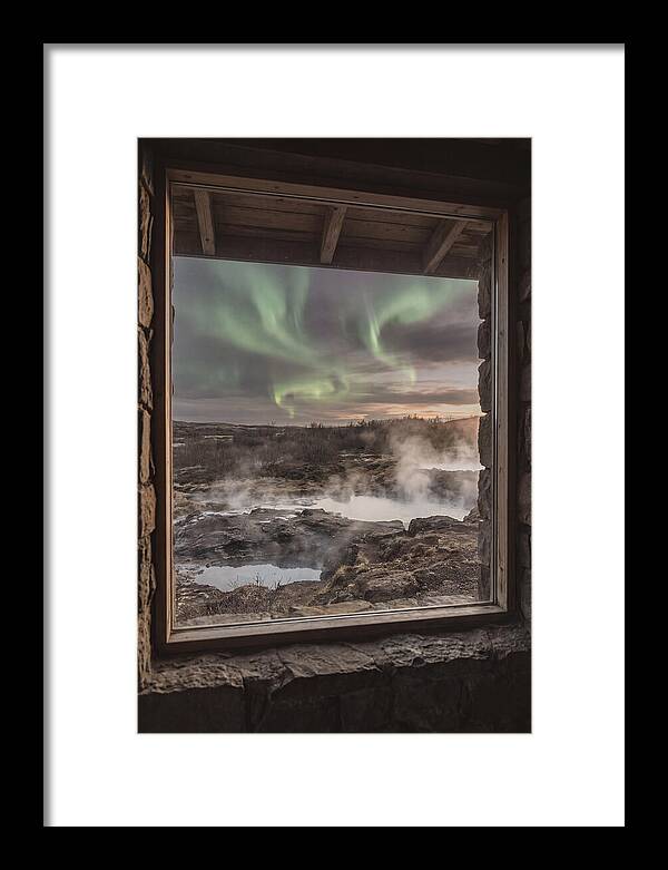 Vibrant Green Aurora Over Volcanic Landscape
