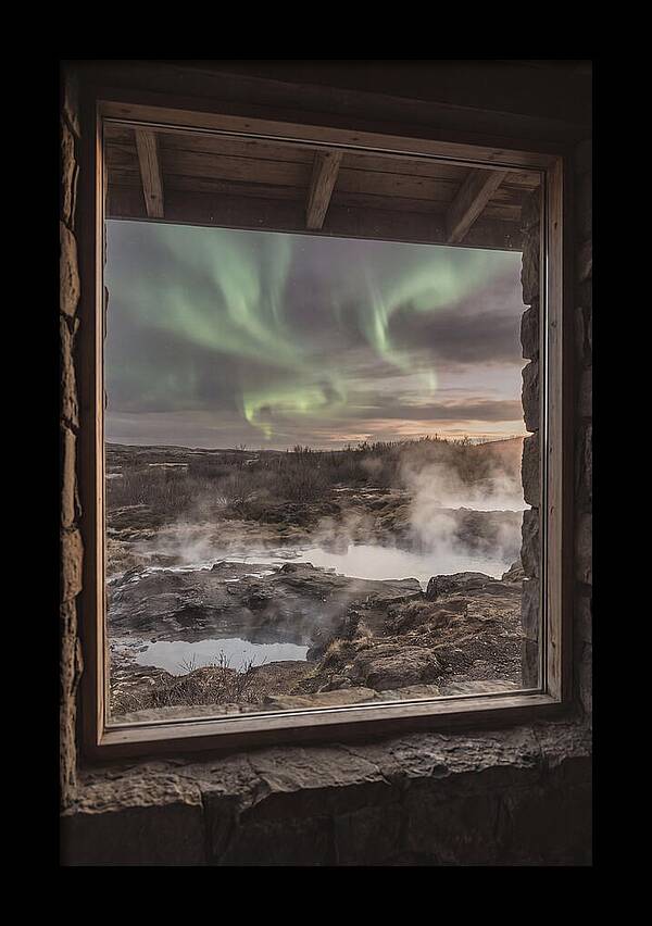 Vibrant Green Aurora Over Volcanic Landscape