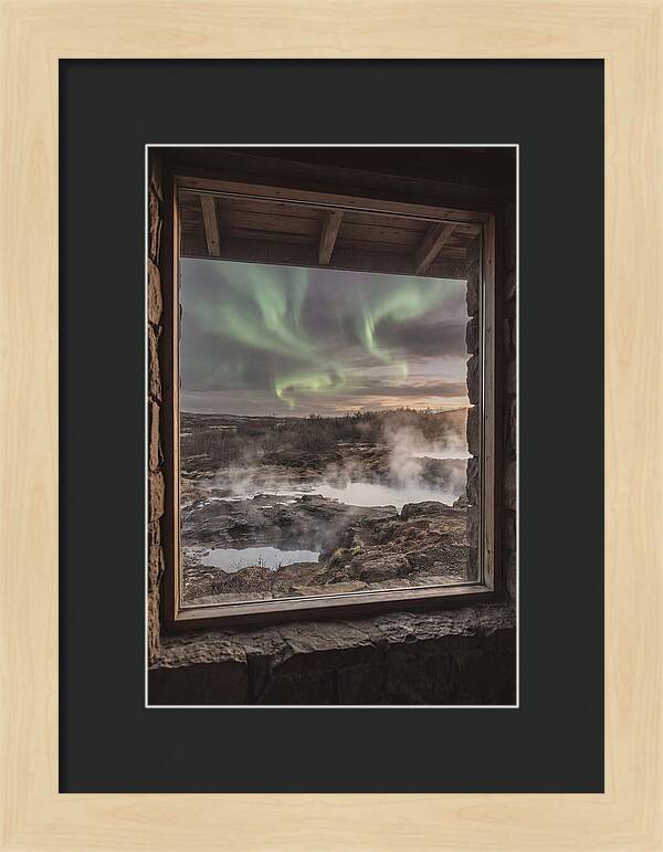 Vibrant Green Aurora Over Volcanic Landscape