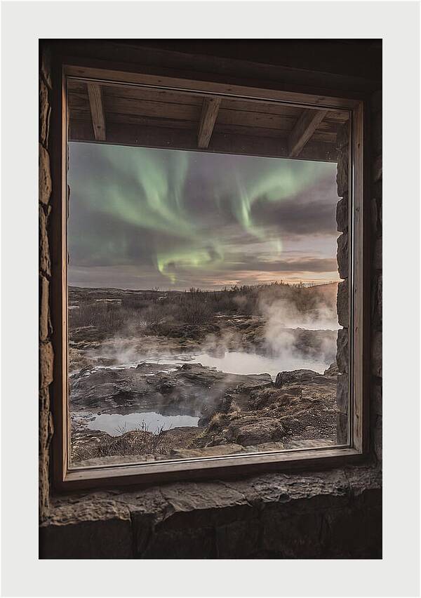 Vibrant Green Aurora Over Volcanic Landscape