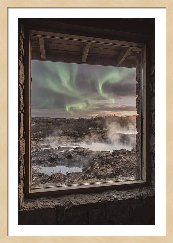 Vibrant Green Aurora Over Volcanic Landscape