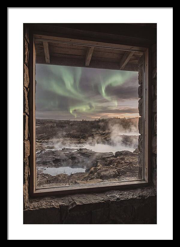 Vibrant Green Aurora Over Volcanic Landscape