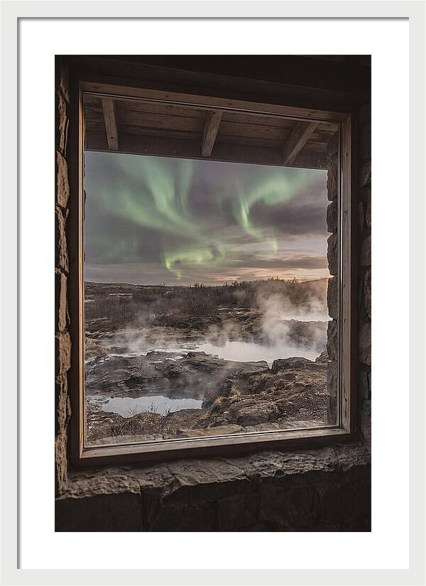 Vibrant Green Aurora Over Volcanic Landscape