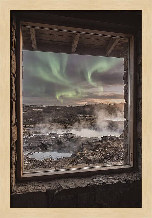 Vibrant Green Aurora Over Volcanic Landscape