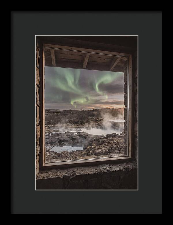 Vibrant Green Aurora Over Volcanic Landscape
