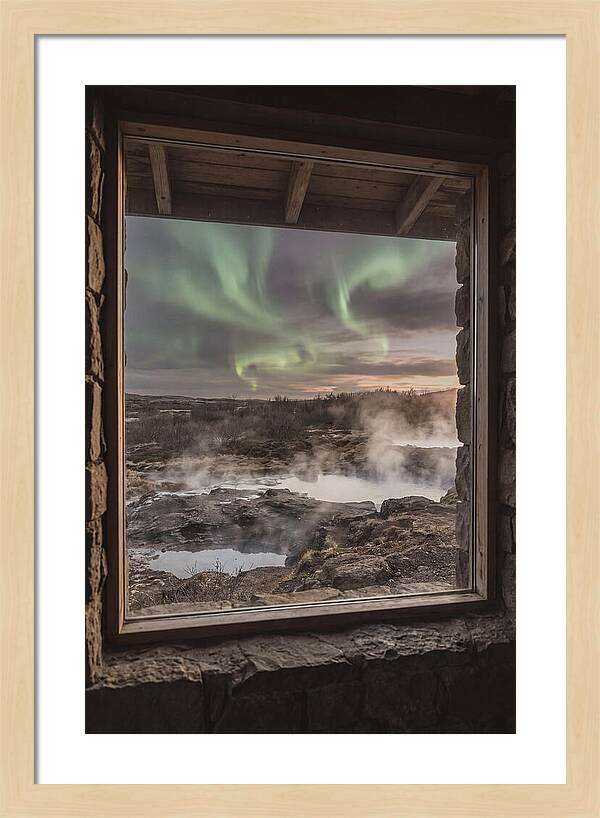 Vibrant Green Aurora Over Volcanic Landscape