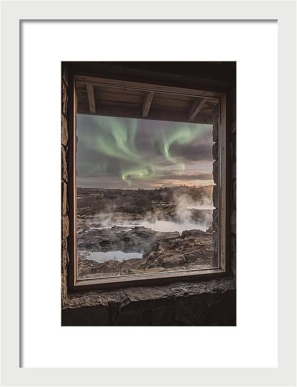 Vibrant Green Aurora Over Volcanic Landscape