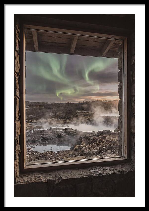Vibrant Green Aurora Over Volcanic Landscape