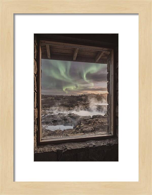 Vibrant Green Aurora Over Volcanic Landscape