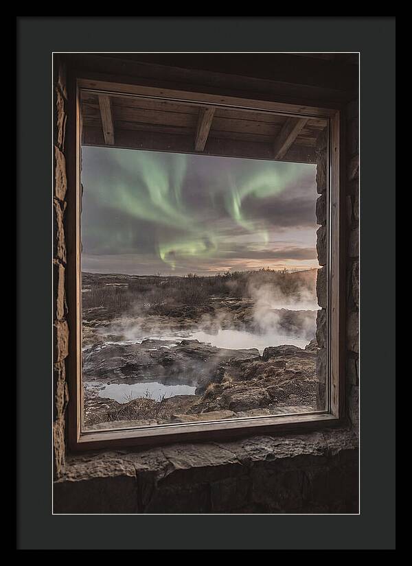 Vibrant Green Aurora Over Volcanic Landscape