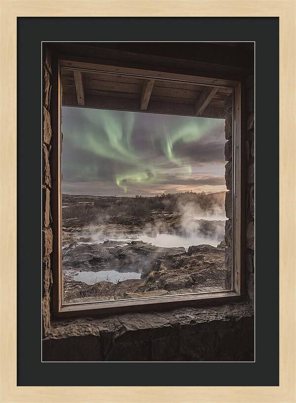 Vibrant Green Aurora Over Volcanic Landscape