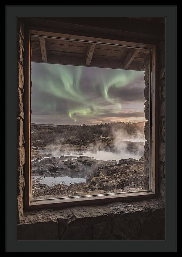 Vibrant Green Aurora Over Volcanic Landscape