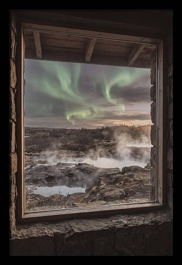 Vibrant Green Aurora Over Volcanic Landscape