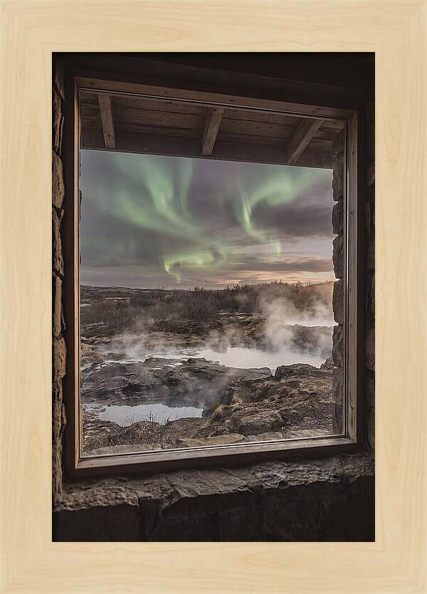 Vibrant Green Aurora Over Volcanic Landscape