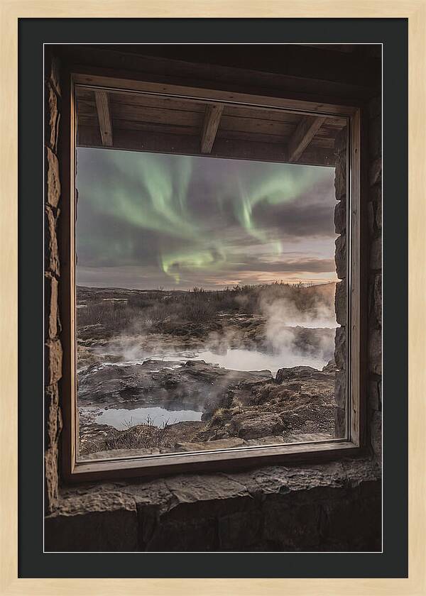 Vibrant Green Aurora Over Volcanic Landscape