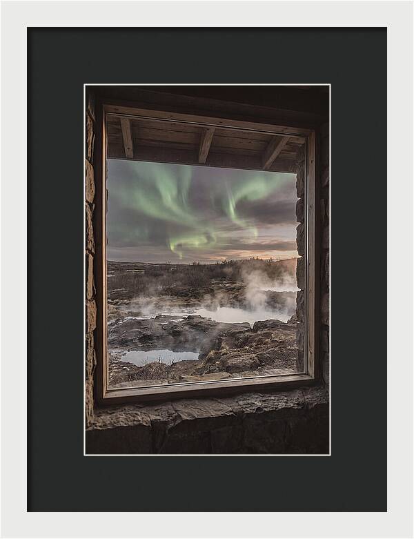 Vibrant Green Aurora Over Volcanic Landscape