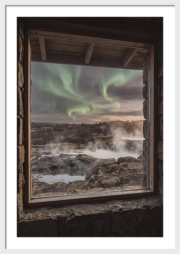 Vibrant Green Aurora Over Volcanic Landscape