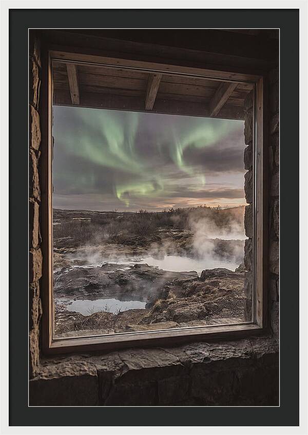 Vibrant Green Aurora Over Volcanic Landscape