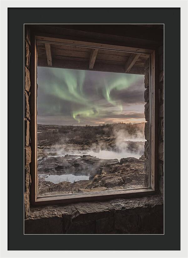 Vibrant Green Aurora Over Volcanic Landscape