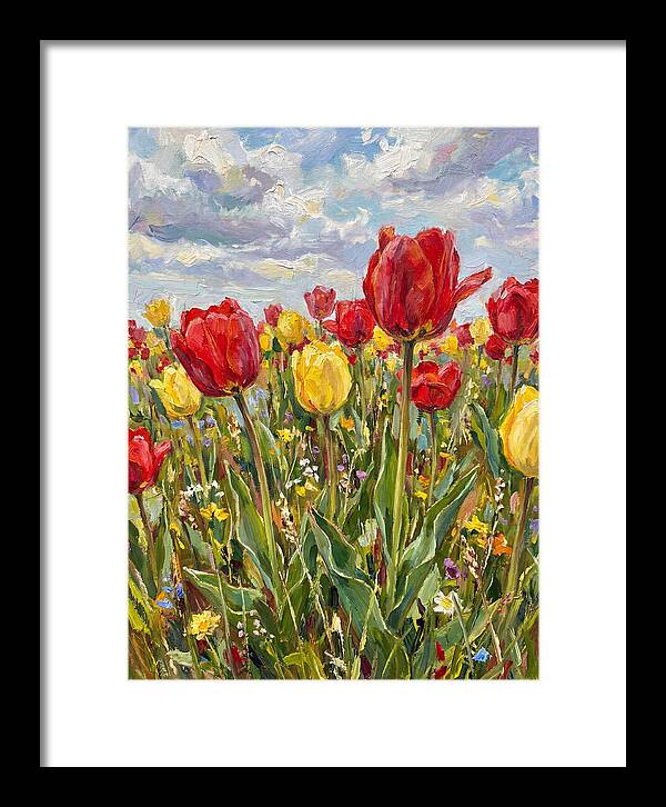 Vibrant Tulip Field Under Clouds