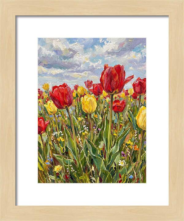 Vibrant Tulip Field Under Clouds