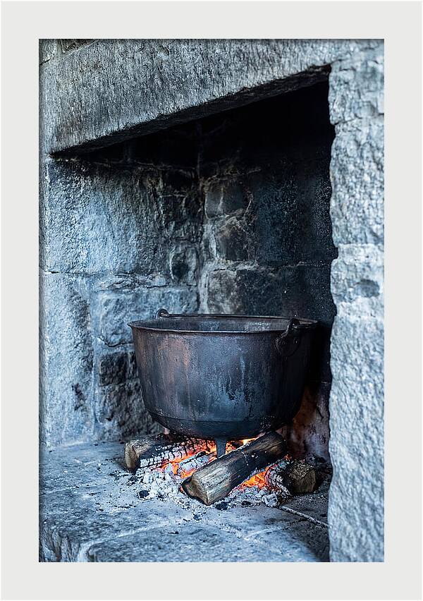 Vintage Iron Cauldron In Fireplace