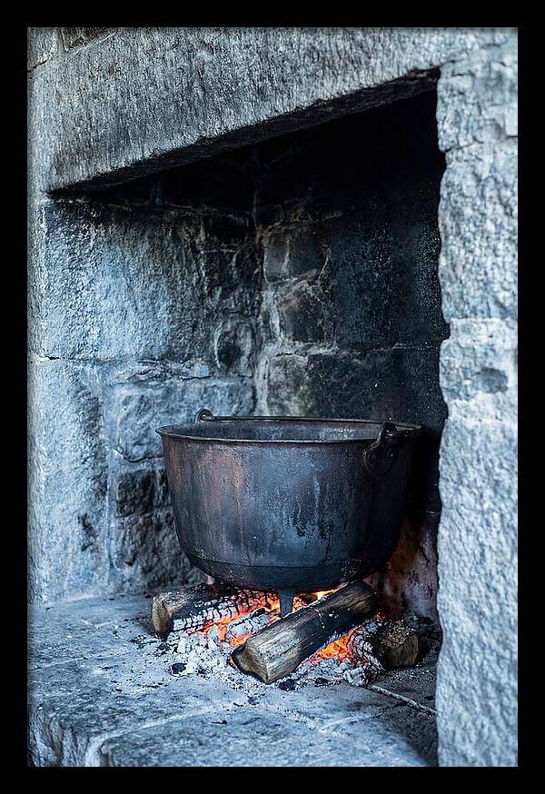 Vintage Iron Cauldron In Fireplace