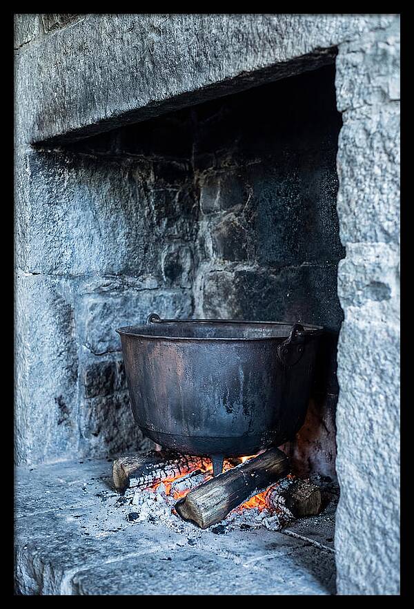 Vintage Iron Cauldron In Fireplace