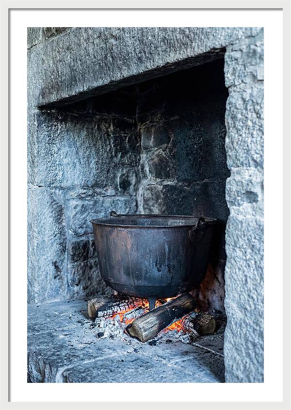 Vintage Iron Cauldron In Fireplace