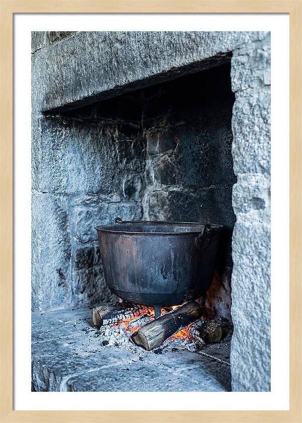 Vintage Iron Cauldron In Fireplace