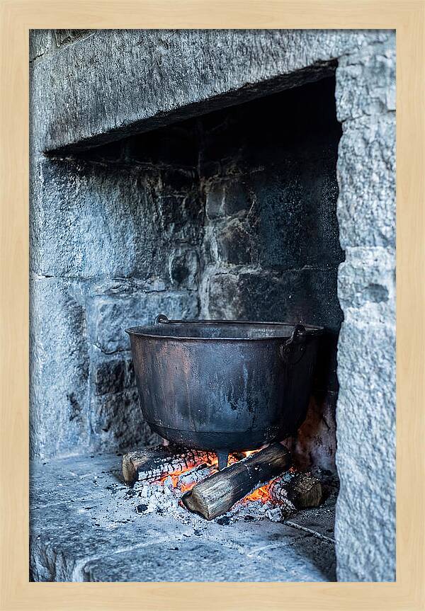 Vintage Iron Cauldron In Fireplace