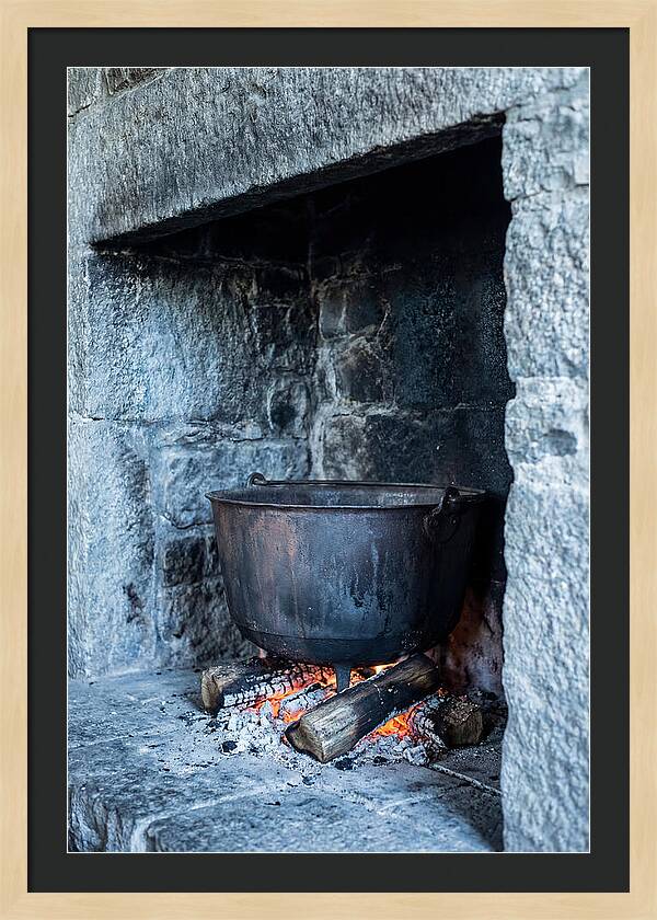 Vintage Iron Cauldron In Fireplace