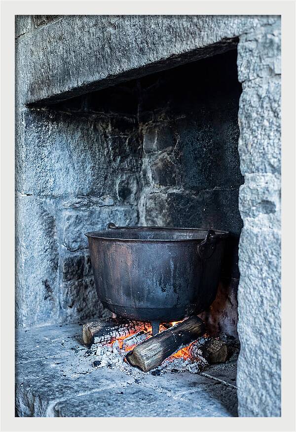 Vintage Iron Cauldron In Fireplace