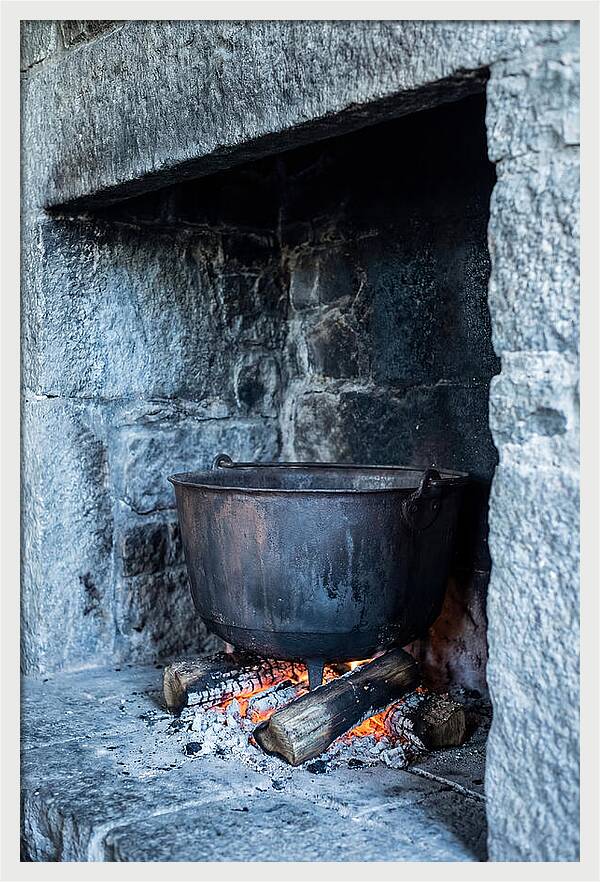 Vintage Iron Cauldron In Fireplace