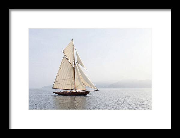 Vintage Wooden Sailboat Under Full Sail