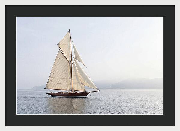 Vintage Wooden Sailboat Under Full Sail