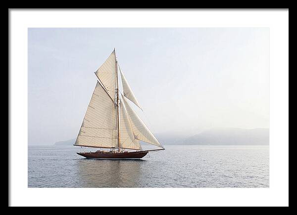 Vintage Wooden Sailboat Under Full Sail