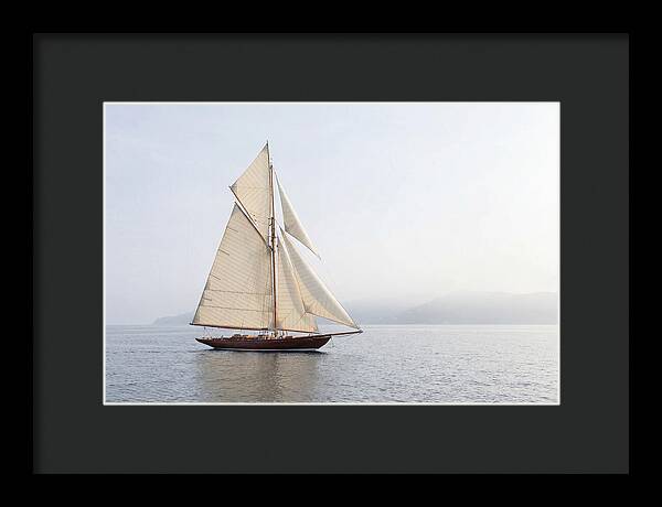 Vintage Wooden Sailboat Under Full Sail