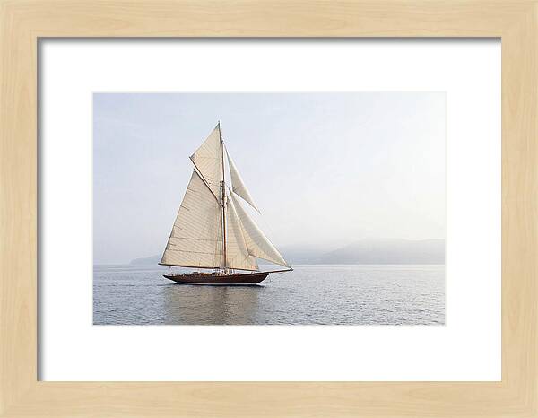 Vintage Wooden Sailboat Under Full Sail