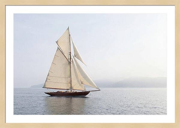 Vintage Wooden Sailboat Under Full Sail