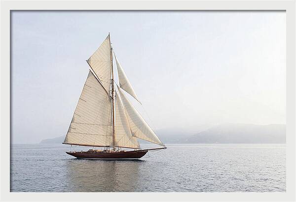 Vintage Wooden Sailboat Under Full Sail