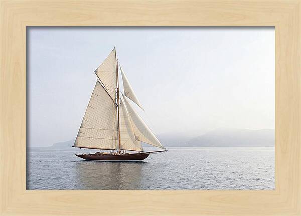 Vintage Wooden Sailboat Under Full Sail